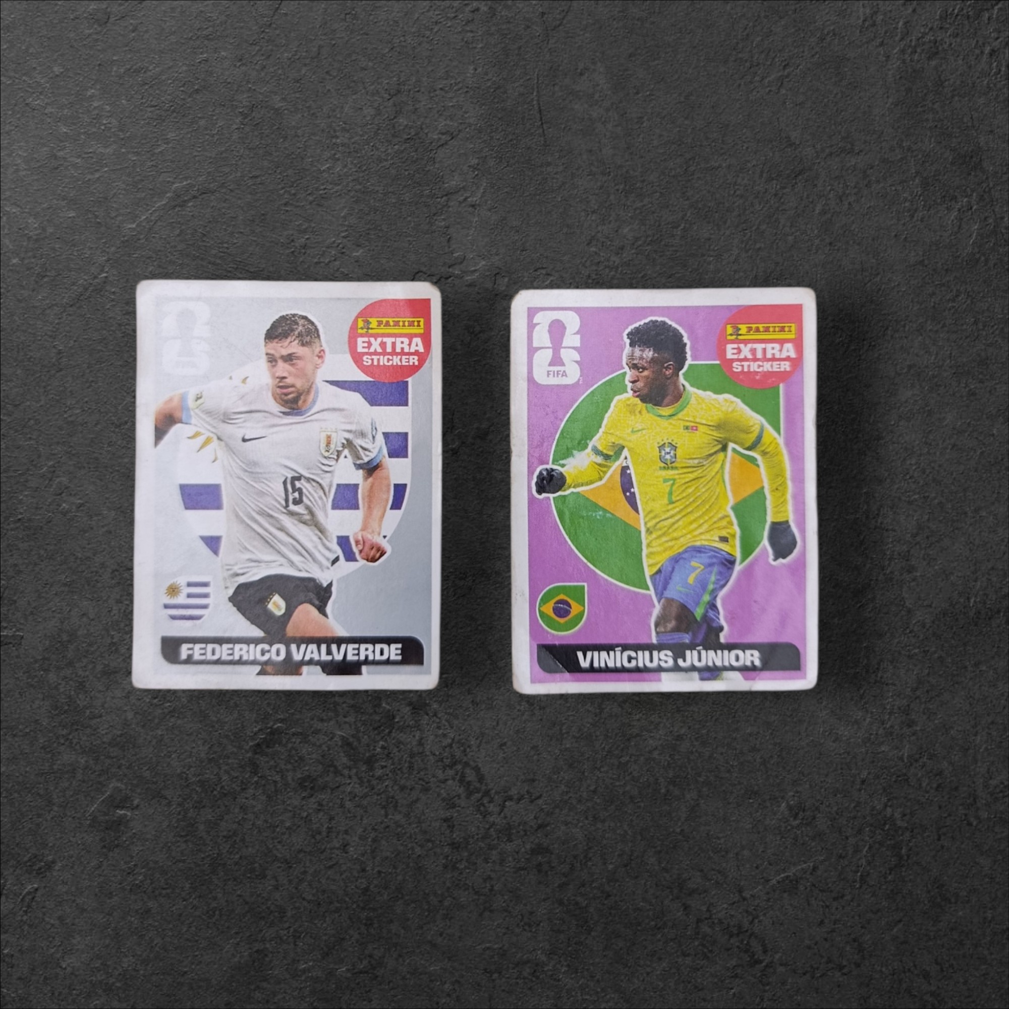 Lote de 2 Figuritas Extras Mundial 2026 (Panini) – Vinícius Jr. y Valverde