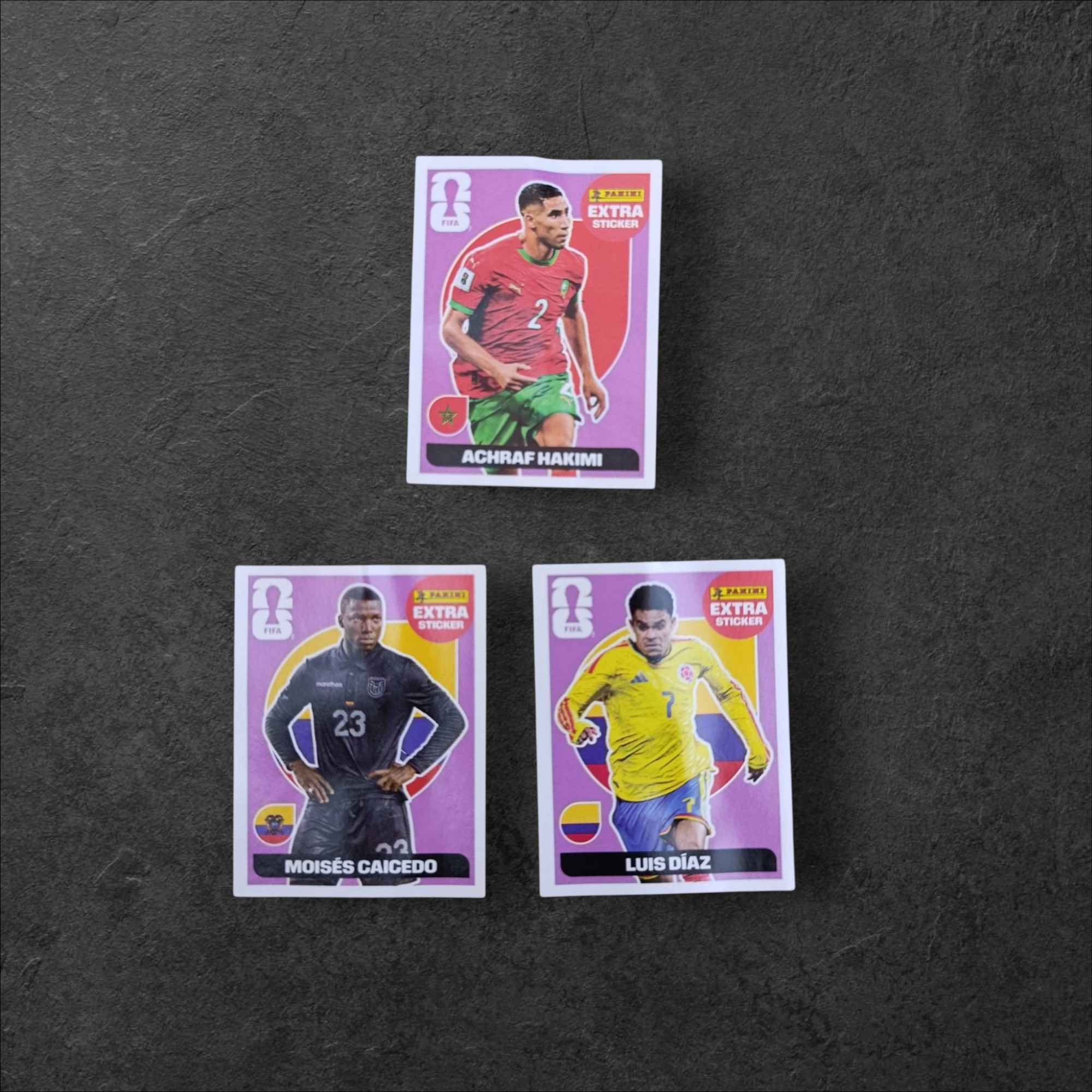 Lote de 3 Figuritas Extra Base Mundial 2026 (Panini) – Caicedo, Hakimi y Díaz
